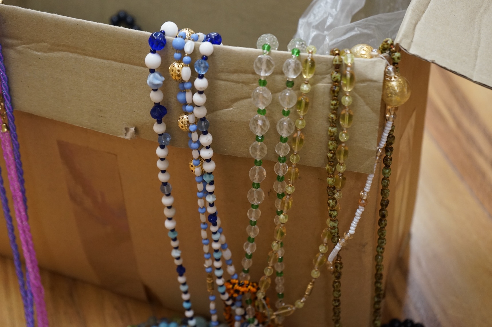 A large collection of glass bead necklaces